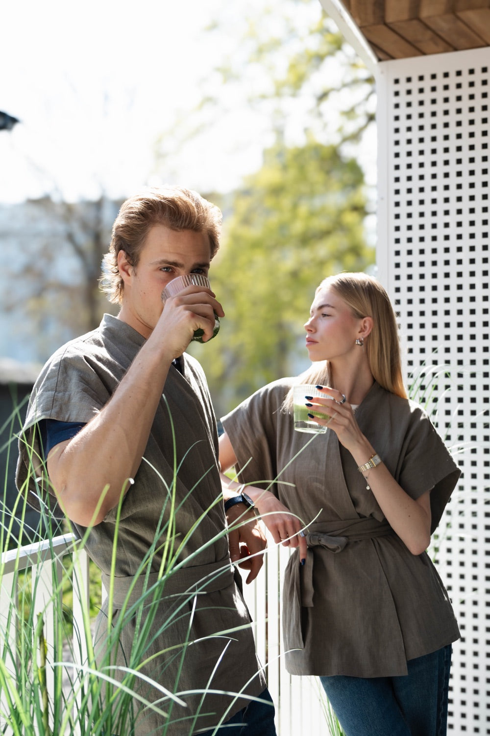 Two people drinking matcha outdoors